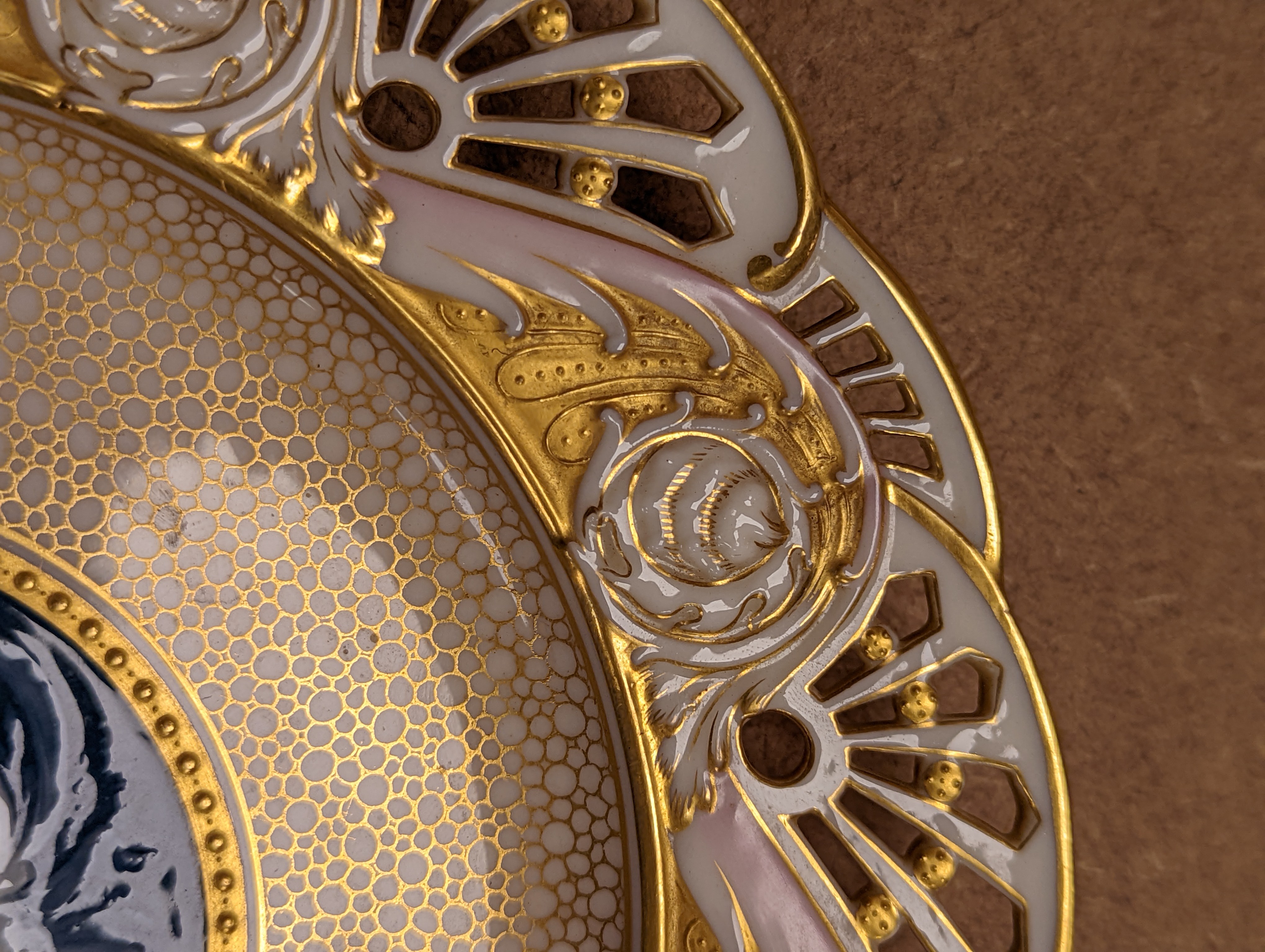 A Mintons pate sur pate cabinet plate, attributed to Alboin Birks, c.1905, diameter 23cm